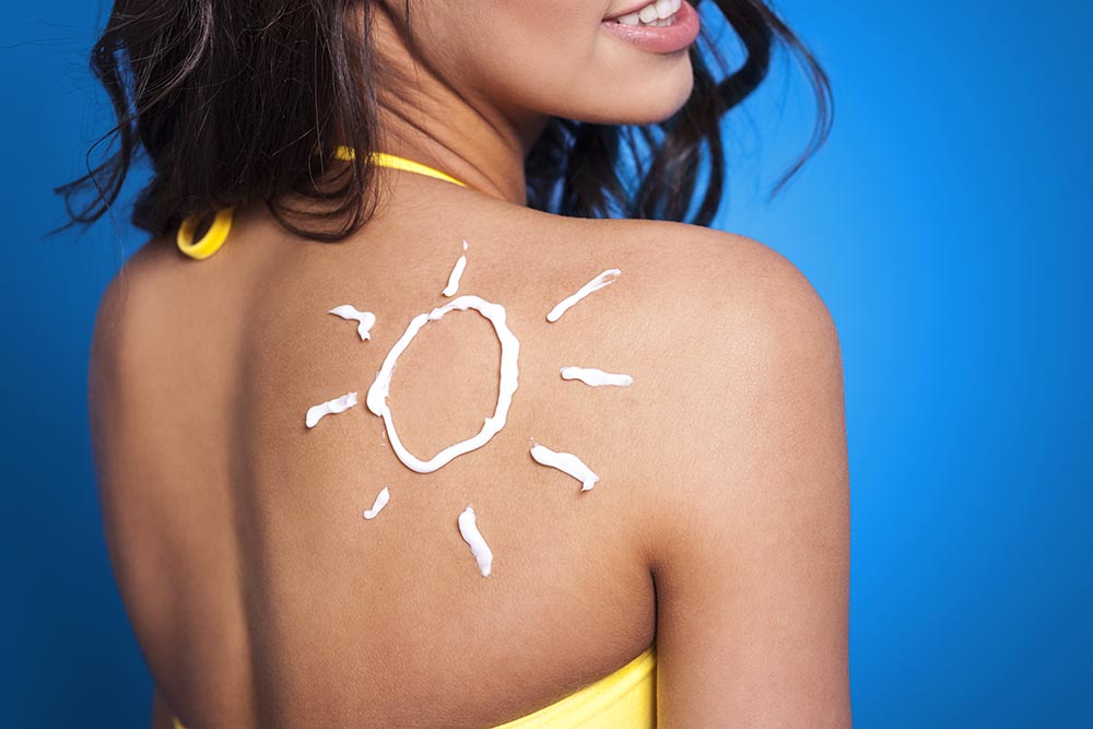 suntan lotion woman s arm sun shape