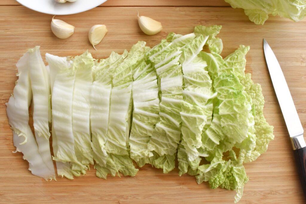 chopped chinese cabbage on a bamboo chopping board 2022 11 09 16 26 19 utc 1
