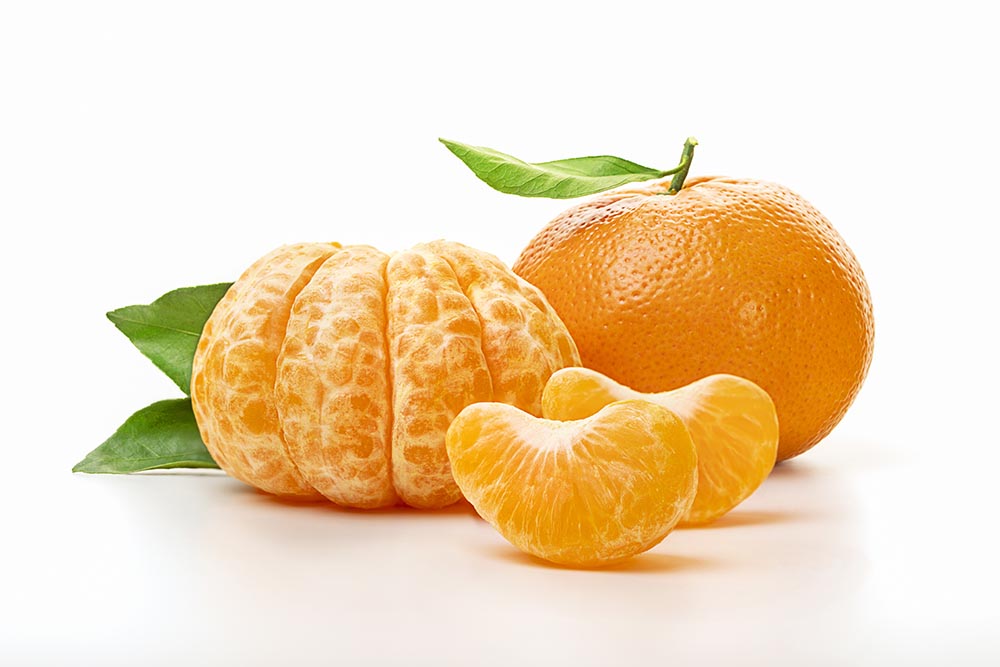 isolated tangerines half peeled tangerine whole mandarin orange fruit with green leaves isolated white background close up