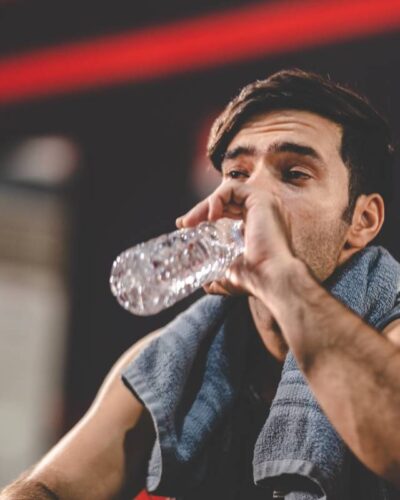 handsome young asian man sitting on modern gym and 2025 04 02 15 52 33 utc 1