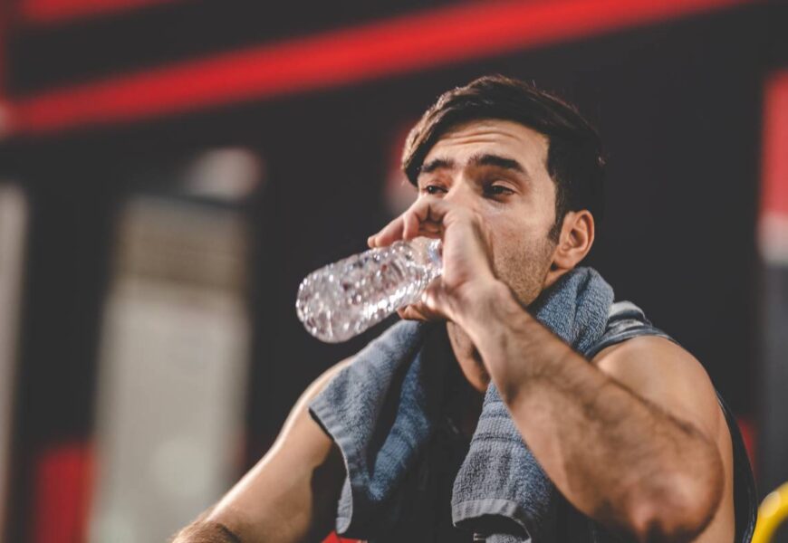 handsome young asian man sitting on modern gym and 2025 04 02 15 52 33 utc 1